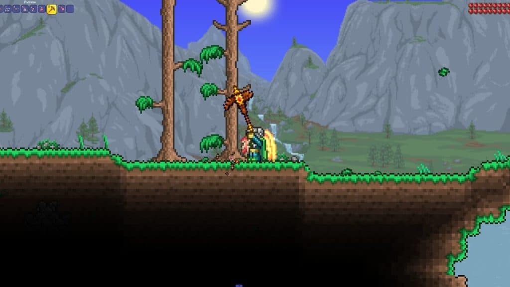 The player using the Picksaw to chop wood in Terraria.